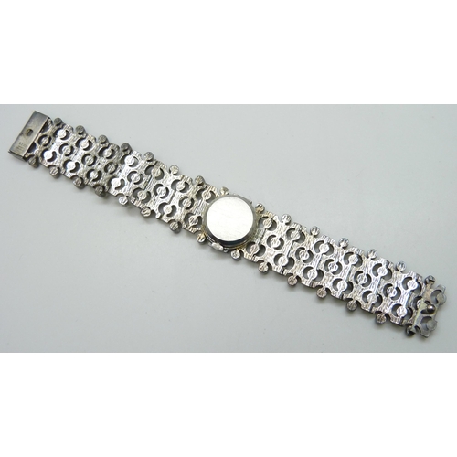 7142 - A Technos silver Brutalist style lady's wristwatch, 70g, 2.1cm wide