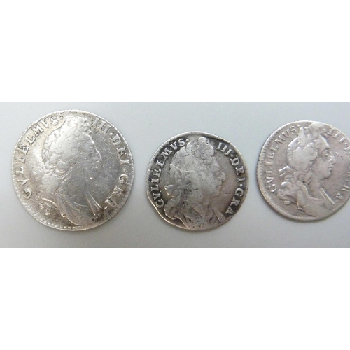 7169 - Coins; four William III silver coins, three shillings, 1696, 1697 and one other, possibly 1696, and ... 