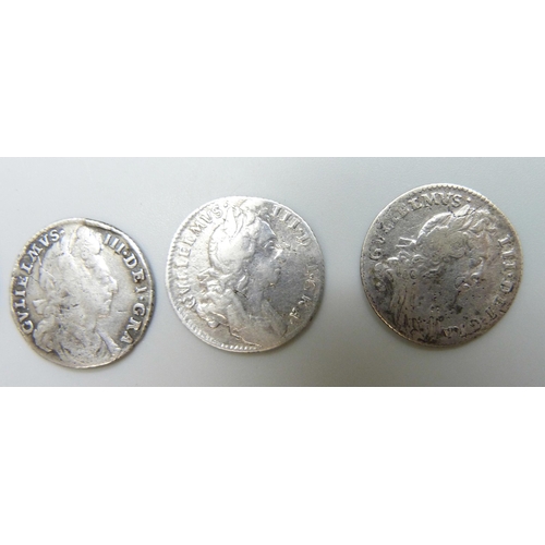 7169 - Coins; four William III silver coins, three shillings, 1696, 1697 and one other, possibly 1696, and ... 