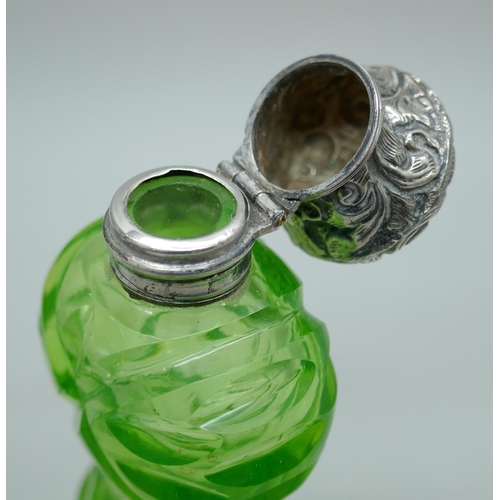 7224 - A silver topped glass scent bottle with monogram, with glass stopper, and one other green glass scen... 