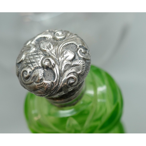 7224 - A silver topped glass scent bottle with monogram, with glass stopper, and one other green glass scen... 