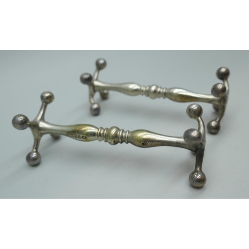 7230 - A pair of Victorian silver knife rests, London 1858, 88g