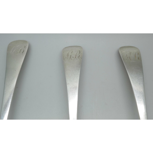 7239 - A set of three George III silver serving spoons with monograms to handles, JB, London 1814, 152g