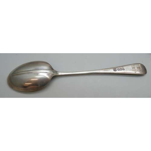 7247 - A silver spoon together with two silver unmatched napkin rings, all cased, 65g