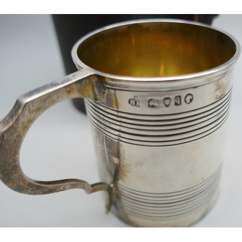 7252 - A Victorian engraved silver christening mug, London 1871, cased, 136g