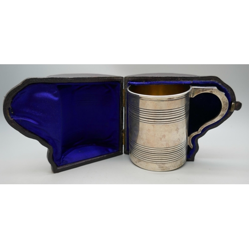 7252 - A Victorian engraved silver christening mug, London 1871, cased, 136g