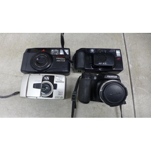 5106 - A large quantity of assorted cameras and other photograph equipment including a Fujifilm Finepix S57... 