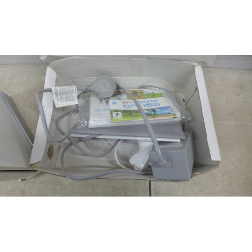 5125 - A Nintendo Wii games console with power supply, console stand, nun-chuck remote attachment and Wii s... 