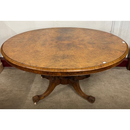 148 - A Victorian figured walnut oval tilt top breakfast table