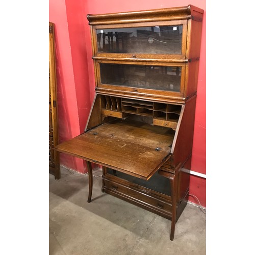 130 - An early 20th Century Globe Wernicke oak sectional stacking bureau bookcase