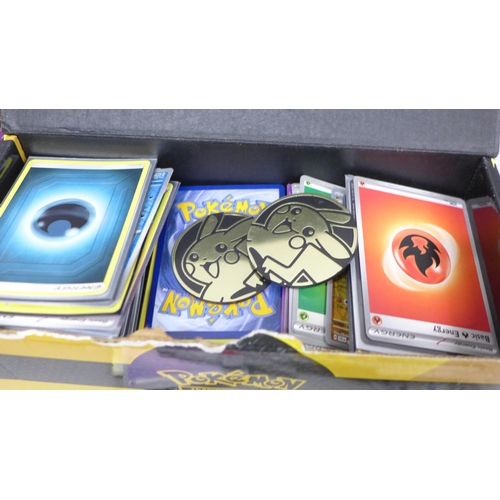 2032 - A large collection of Pokémon cards with eight Marvel badges and two other badges