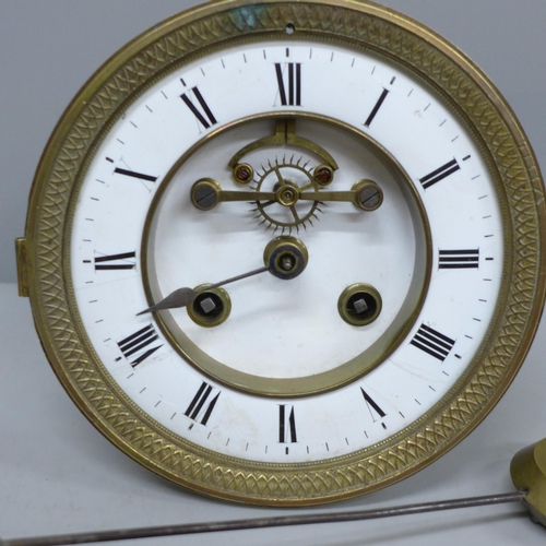 2035 - A clock movement with white enamelled dial and a pendulum, also a double sovereign case with stamp d... 