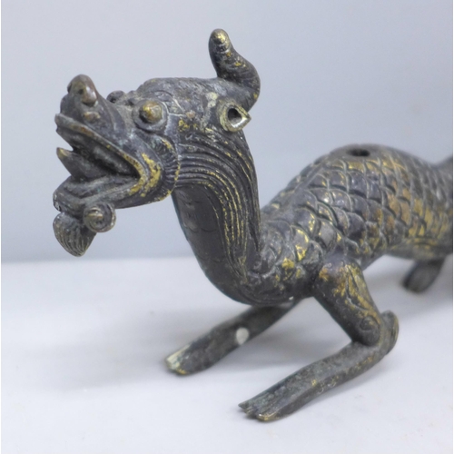 2037 - A Chinese bronze dragon, 21cm