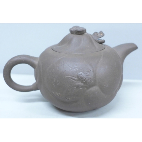 2039 - A Chinese terracotta teapot in the form of a dragon in the clouds with movable dragon head lid