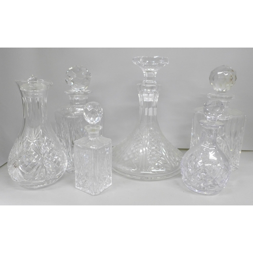 2085 - A collection of six glass decanters including a ships decanter