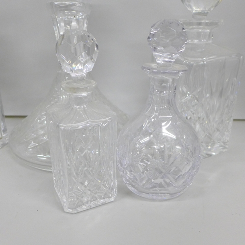 2085 - A collection of six glass decanters including a ships decanter