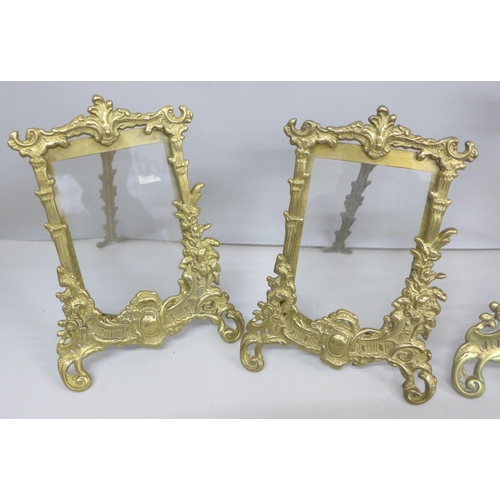 2097 - Four gilt brass photograph frames with stands