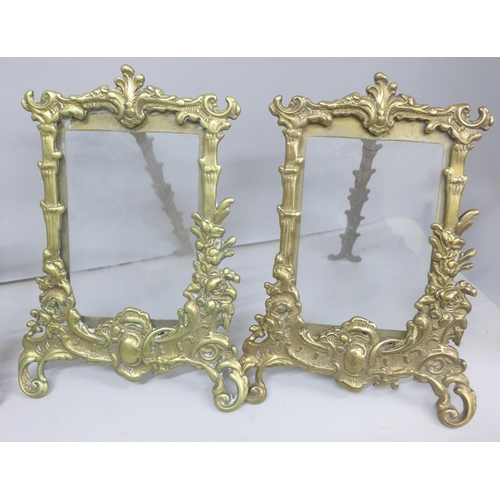 2097 - Four gilt brass photograph frames with stands