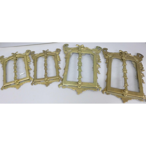 2097 - Four gilt brass photograph frames with stands