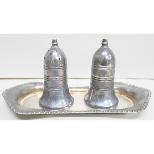 2106 - A tantalus with plated stand, goblets, vase and a silver napkin ring