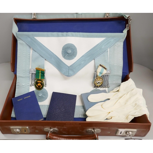 2146 - A case containing Masonic regalia, including two books: Emulation Ritual published 1976, and Constit... 