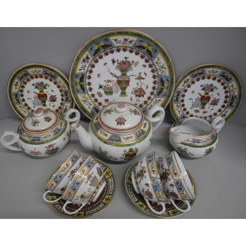 2161 - A Chinese porcelain tea service comprising of teapot, jug, teacups, saucers, small plates and one la... 