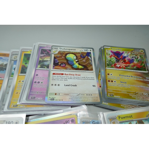 2168 - A collection of 120+ rare holographic Pokémon cards in protective sleeves