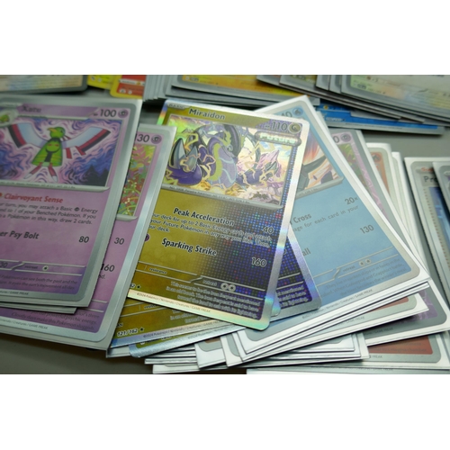 2168 - A collection of 120+ rare holographic Pokémon cards in protective sleeves