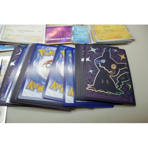 2168 - A collection of 120+ rare holographic Pokémon cards in protective sleeves