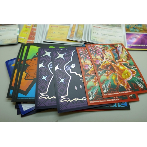 2168 - A collection of 120+ rare holographic Pokémon cards in protective sleeves