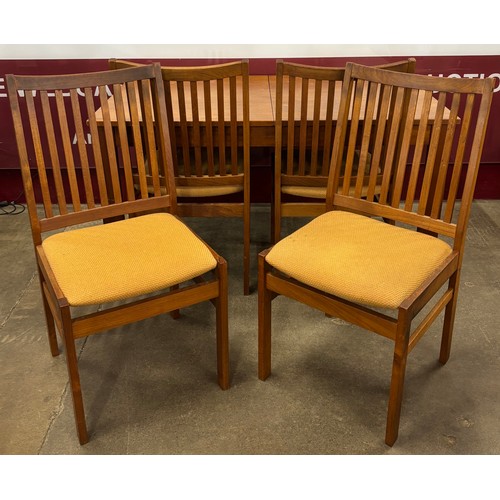 44 - A Danish Mogens Kold teak rectangular extending dining table and four chairs