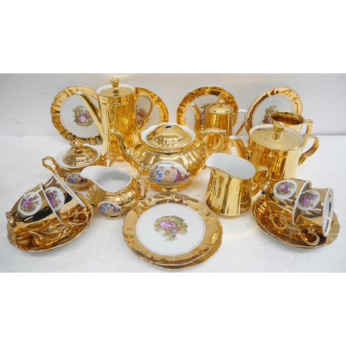 2263 - A gold china tea service comprising four Royal  Worcester items, coffee, tea pot, milk jug, water ju... 