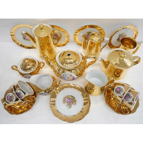 2263 - A gold china tea service comprising four Royal  Worcester items, coffee, tea pot, milk jug, water ju... 