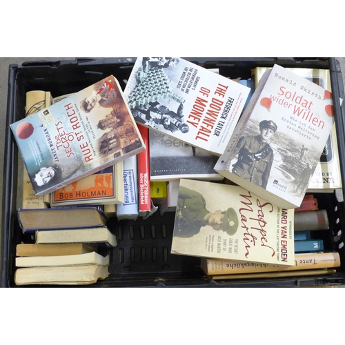 2267 - Nine boxes of assorted hardback and paperback books, a mix of German and English language, military ... 