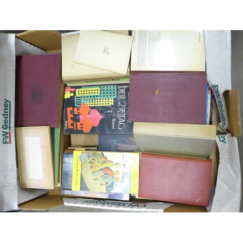 2267 - Nine boxes of assorted hardback and paperback books, a mix of German and English language, military ... 