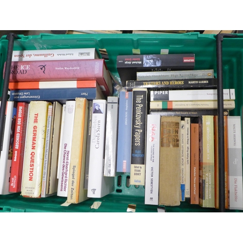 2267 - Nine boxes of assorted hardback and paperback books, a mix of German and English language, military ... 