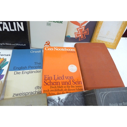 2268 - Seven boxes and two bags of assorted hardback and paperback books, a mix of German and English langu... 