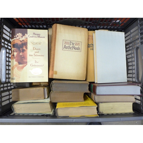 2269 - Nine boxes of assorted hardback and paperback books, a mix of German and English language, military ... 