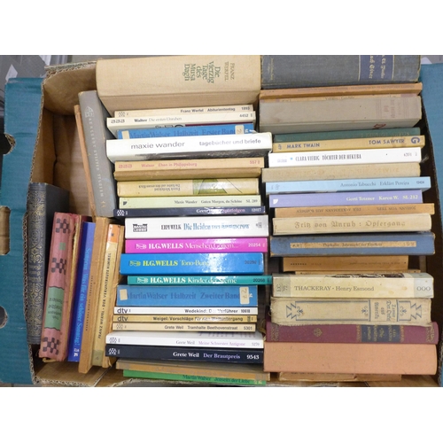 2269 - Nine boxes of assorted hardback and paperback books, a mix of German and English language, military ... 