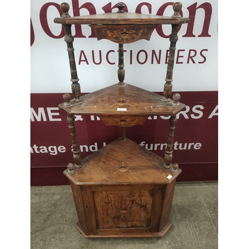 205 - A Victorian inlaid walnut three tier corner whatnot