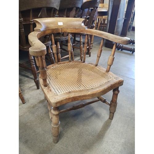 212 - A Victorian elm smokers bow chair