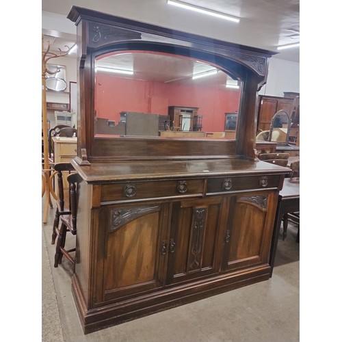 218 - An Art Nouveau walnut mirrorback sideboard