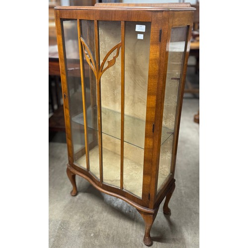 186 - An early 20th Century walnut display cabinet