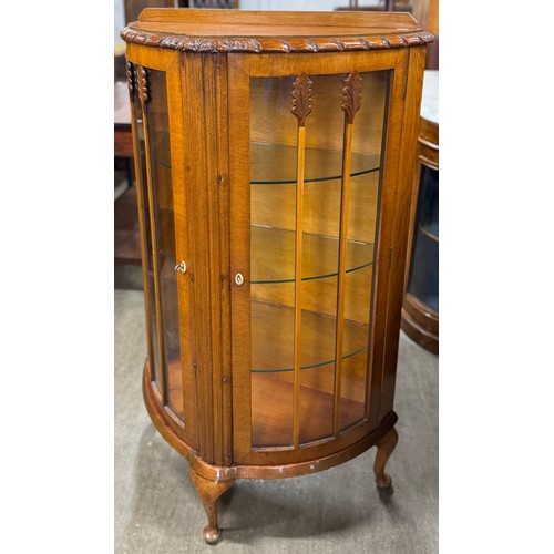 187 - An early 20th Century oak demi lune display cabinet