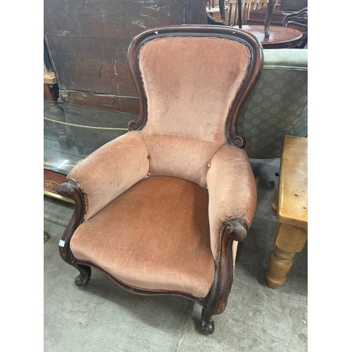 281 - A Victorian mahogany and fabric upholstered armchair