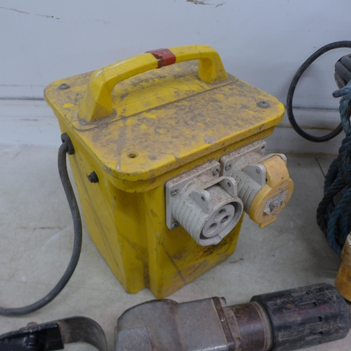 5193 - A 110V double socket transformer, a 110V Makita demolition hammer and a 110V submersible pump