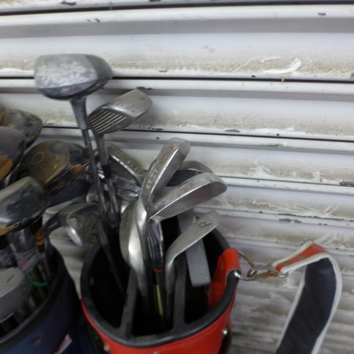 5198 - A large quantity of assorted golf equipment including 3 bags and a quantity of golf clubs including ... 