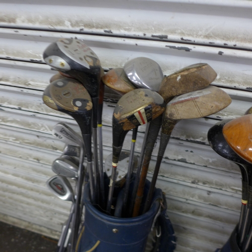 5198 - A large quantity of assorted golf equipment including 3 bags and a quantity of golf clubs including ... 