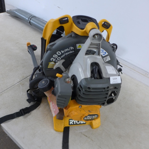 5204 - A Ryobi push button start back pack petrol driven leaf blower