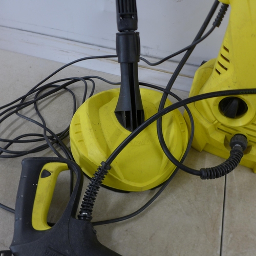 5206 - A Karcher K2 pressure washer with hose, lance and patio cleaner attachment